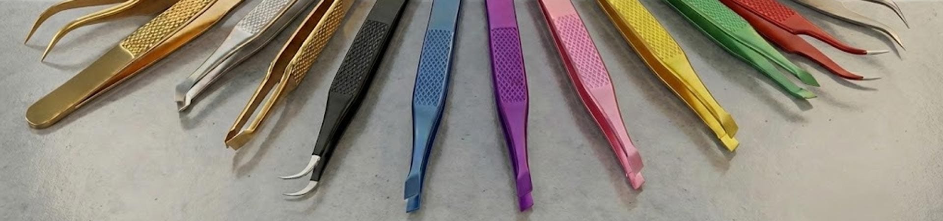Collection of professional stainless steel eyebrow tweezers and eyelash extension tweezers displayed on premium background