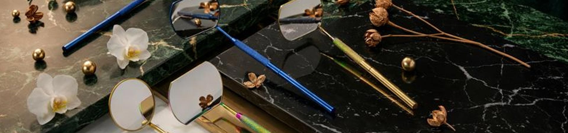 Professional stainless steel lash extension inspection mirrors featuring different shapes & colors with knurled grip handles displayed for wholesale & private label beauty supplies